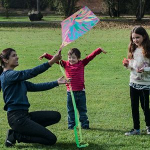 A family playing with a kite