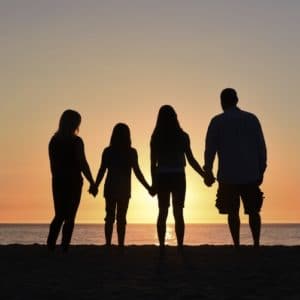 Family of woman and man with two daughters aged 6 and 13