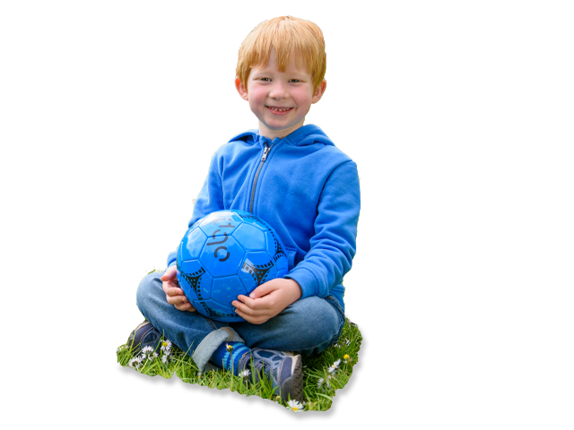 boy sitting with a football