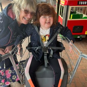 Debbie and her daughter Bo playing outside a supermarket