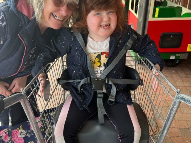 Debbie and her daughter Bo playing outside a supermarket