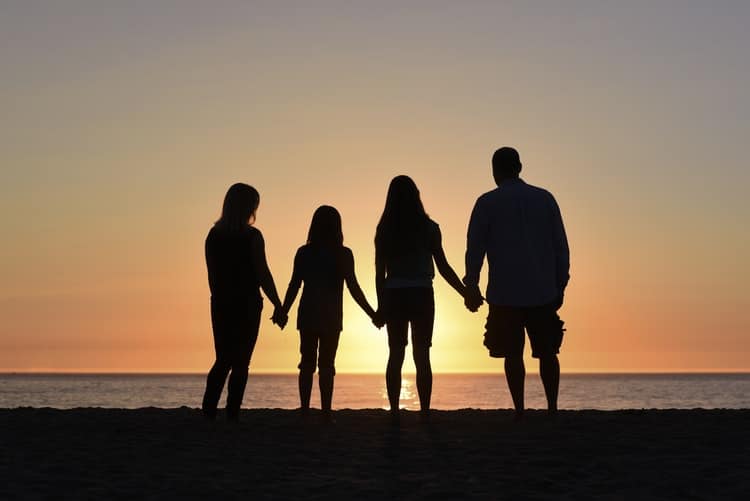 Family of woman and man with two daughters aged 6 and 13