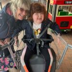 Debbie and her daughter Bo playing outside a supermarket