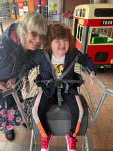 Debbie and her daughter Bo playing outside a supermarket