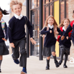 Primary school children running towards the camera