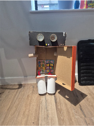 Photograph of a robot made of cardboard