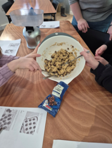 Photograph of children making cookies