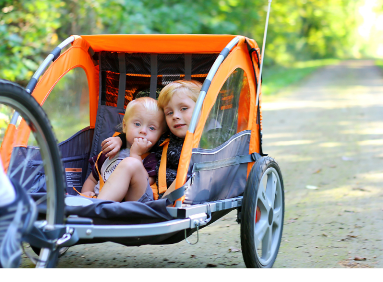 Kids in bike trailer.